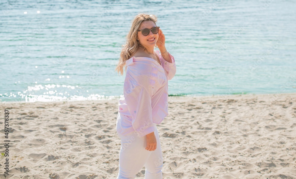 Plus size European blonde woman at beach, vacation, enjoy the life, walks. Life of people xl size, happy natural beautiful lady. Concept of overweight Plus size European blonde woman at beach, vacation, enjoy the life, walks. Life of people xl size, happy natural beautiful lady. Concept of overweight