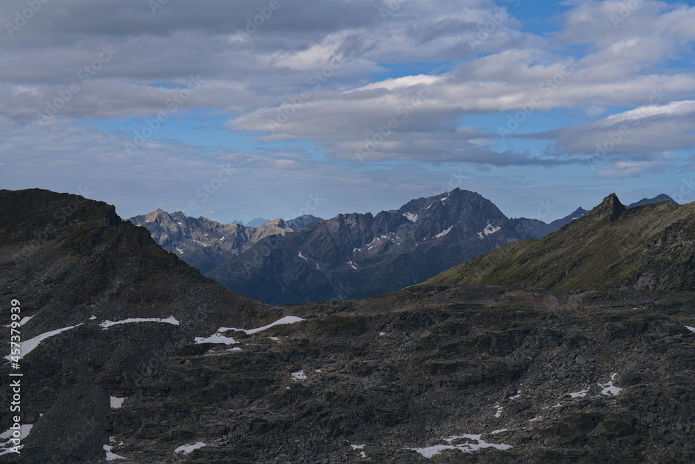 Hiking in Mölltaler Glacier area, high mountains, glacier, waterdams and cows on pastures 