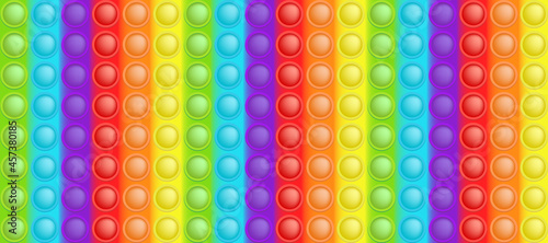 Popit colorful rainbow background like a fashionable silicon toy for fidgets. Addictive anti stress bubble pop it toy in bright colors. Vector illustration in rectangle format suitable for bunner. photo