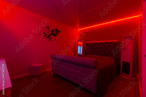 Modern master bedroom with screech celling and led light design 