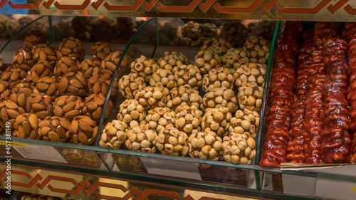 Assorted Turkish delights with different flavors and nuts in different colors, sweets cut into slices