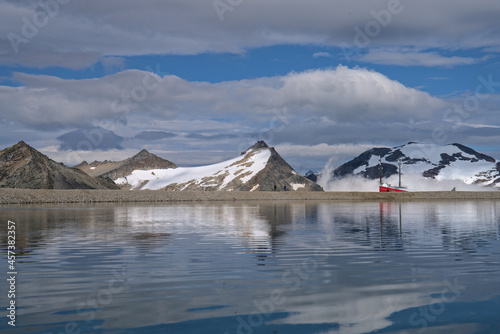 Hiking in Mölltaler Glacier area, high mountains, glacier, waterdams and cows on pastures 