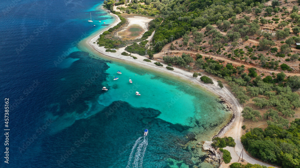 Aerial drone photo of paradise exotic azure beach of Agios Ioannis a famous yacht and sail boat visit in Ionian island of Meganisi, Greece