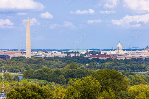 Skyline of Washington DC including the Washington Monument, and the Capitol.