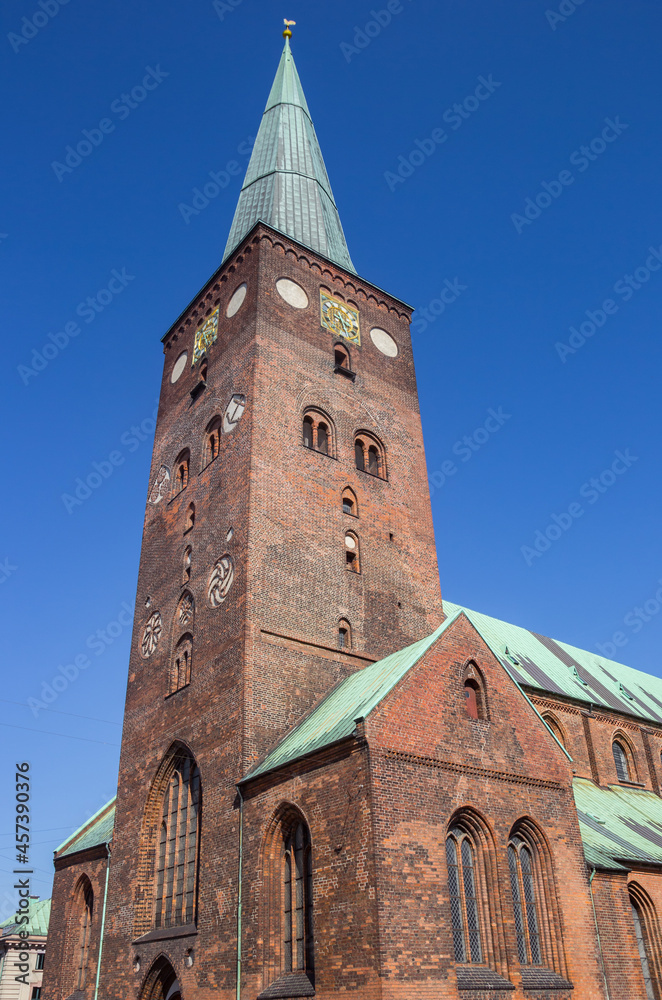 Fototapeta premium Tower of the historic Dom church in the center of Aarhus, Denmark