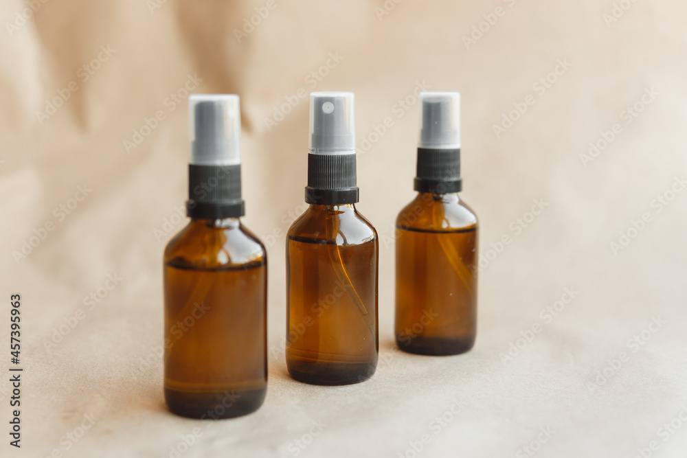 Set of amber bottles for essential oils and cosmetics. Glass bottle. Dropper, spray bottle