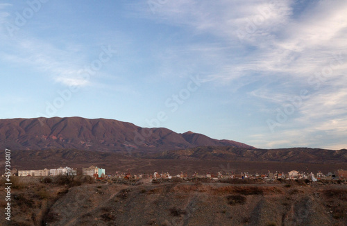 Ancient cemetery on the mountaintop under a beautiful sunset sky in the Andes mountains, Cachi, Salta, Argentina.