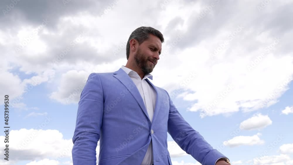 smiling adult man in formalwear checking time waiting for date, time smiling adult man in formalwear checking time waiting for date, time