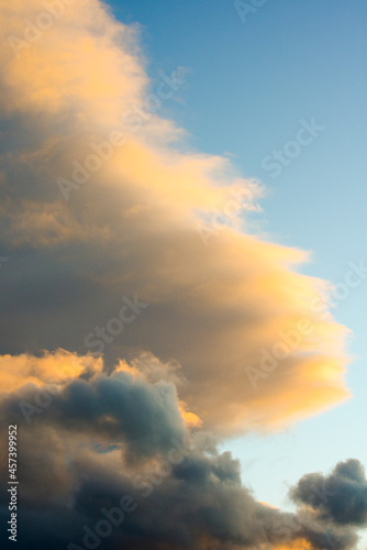 Clouds With Color Over A Blue Sky