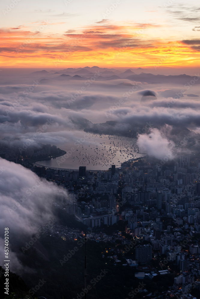 Beautiful sunrise view from Corcovado Mountain to Sugar Loaf and city
