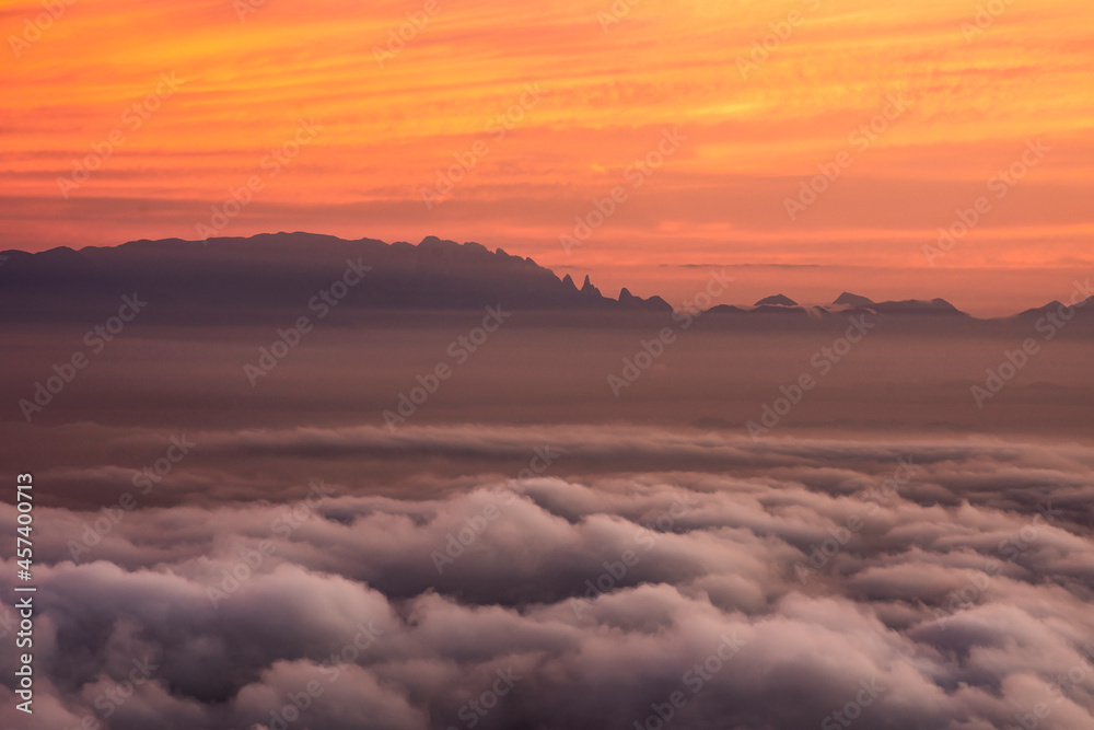Beautiful sunrise view from Corcovado Mountain with orange clouds