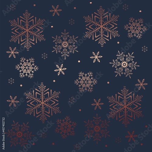 Luxury seamless winter pattern with rose gold snowflakes and navy blue background. Flat style winter holiday design for Christmas greeting card, decor, banner, flyer, poster, fabric.Vector illustratio