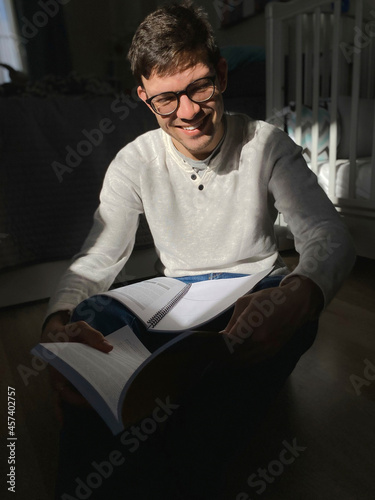 Photography Portrait of happy young  man studying at home on self isolation