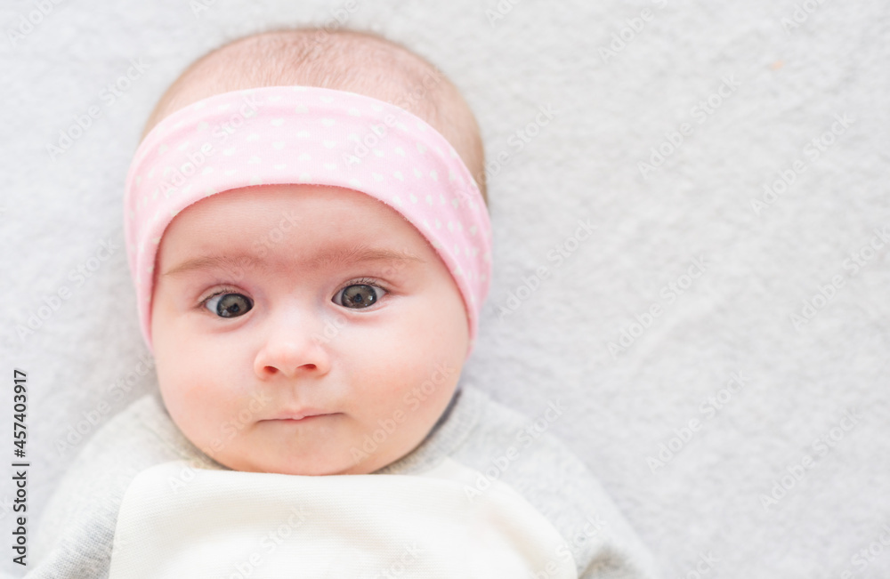 close-up portrait of a beautiful baby on bright background. New born concept Copy space close-up portrait of a beautiful baby on bright background. New born concept Copy space