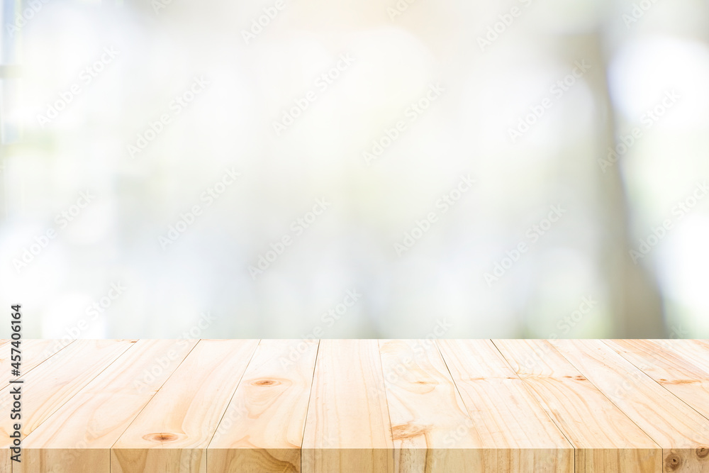 Empty wooden table for present product on coffee shop blur backg Empty wooden table for present product on coffee shop blur backg