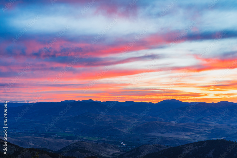 Red and orange clouds during sunrise in Methow valley, Washington