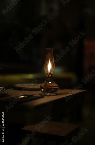 candle lamp in the dark of a table