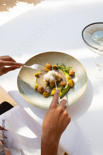 Cutting into fine dining dish