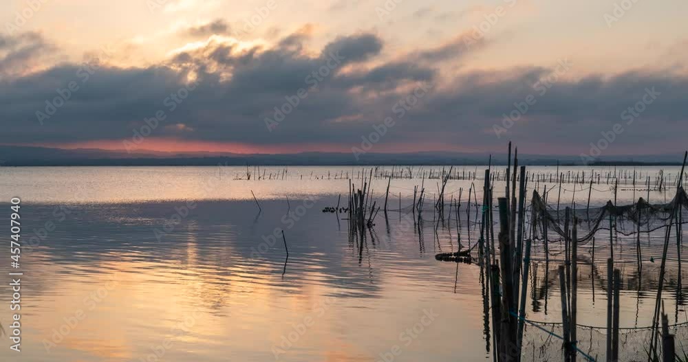 Time lapse sunset in the lagoon of Valencia Time lapse sunset in a lak Time lapse sunset in the lagoon of Valencia Time lapse sunset in a lak