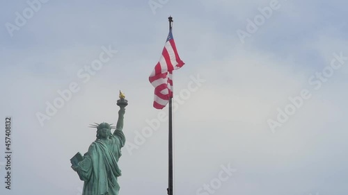The statue of Liberty and flag of USA, New York City, USA