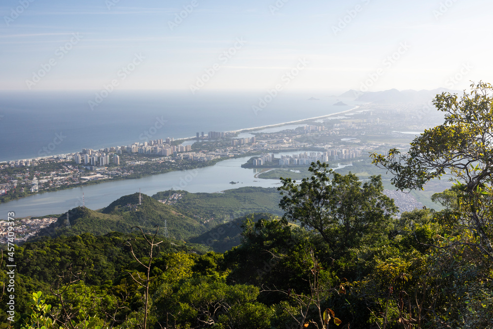 Beautiful view from green rainforest mountain to city and ocean