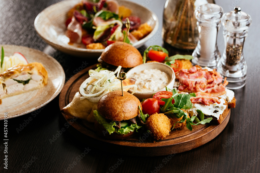 american burger with potatoes, sauce, snacks american burger with potatoes, sauce, snacks