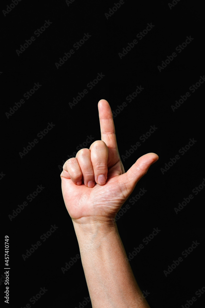 Letter L International sign language dark background Letter L International sign language dark background