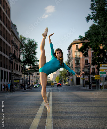 Portrait of a young ballerina on pointe shoes in the street