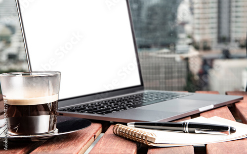 laptop, coffee and notepad for remote working in Bangkok