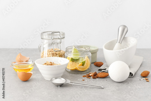 Natural ingredients for homemade cosmetics on light background