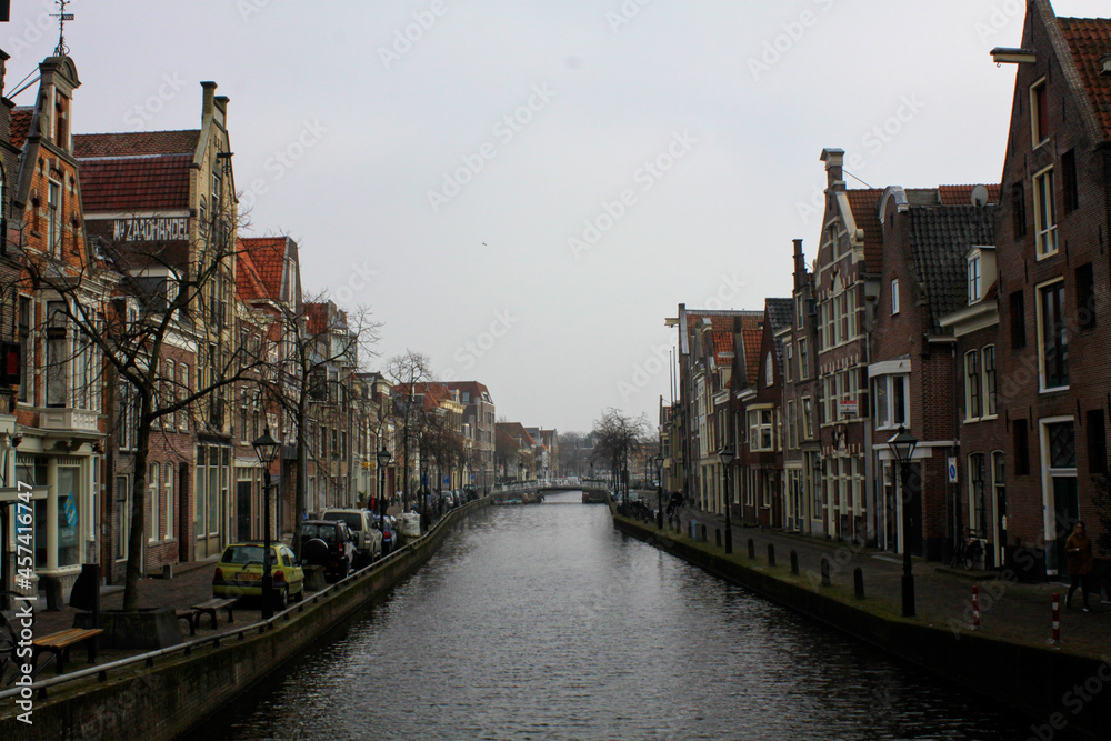 Naklejka premium View on the architecture of old holland buildings on both sides of the canal embankment