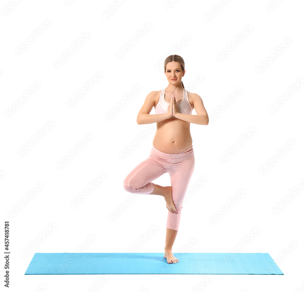 Young pregnant woman practicing yoga on white background Young pregnant woman practicing yoga on white background