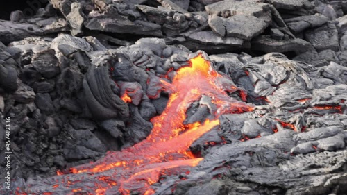 Lava flowing from active volcano in Iceland photo