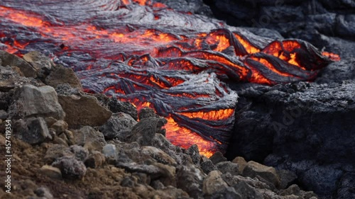 Lava flowing from active volcano in Iceland photo