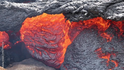 Lava flowing from active volcano in Iceland photo