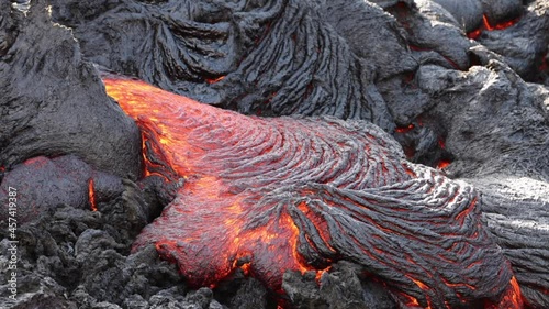 Lava flowing from active volcano in Iceland photo