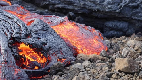 Lava flowing from active volcano in Iceland photo