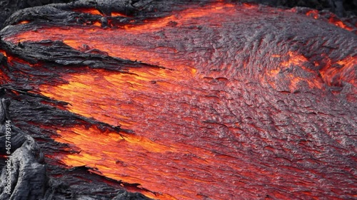 Lava flowing from active volcano in Iceland photo