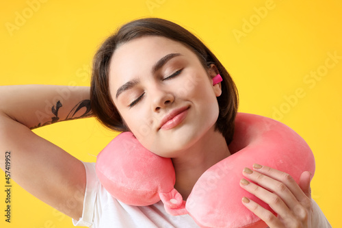 Young woman with ear plug a...