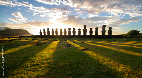 Sunrise over Moai stone sculptures at Ahu Tongariki, Easter island, Chile. photo