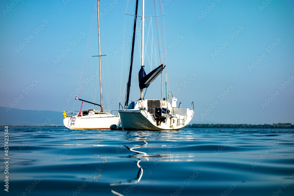 Fototapeta premium Sailboat moored in the harbor for boats, yachts and sailboats in a recreational destination