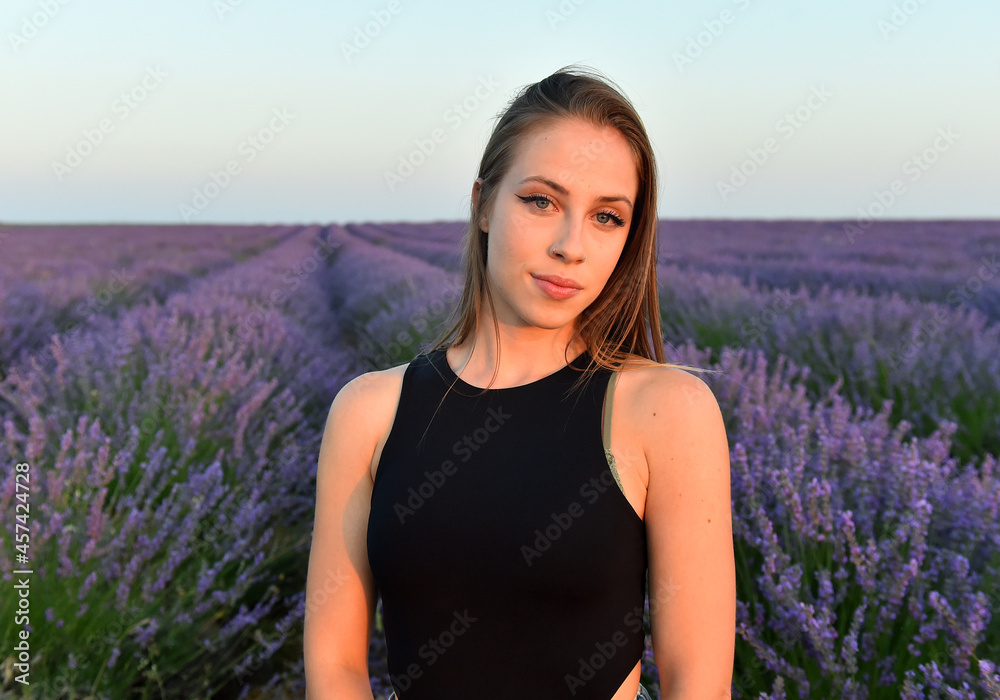 a caucasian blonde model in a pretty lavender field in spain a caucasian blonde model in a pretty lavender field in spain
