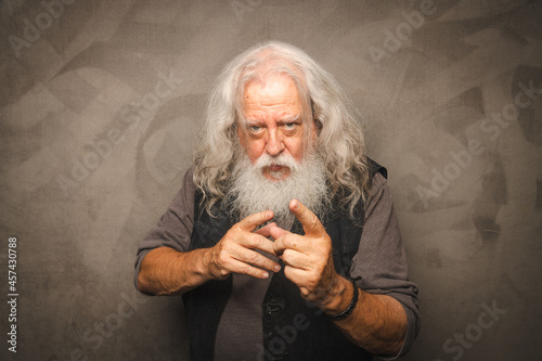 Grizzled Old Rogue with Long Gray Hair and White Beard Clowns for the Camera photo