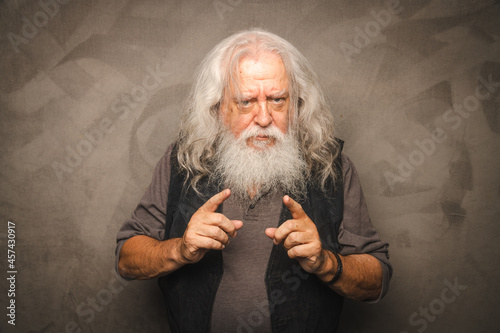 Grizzled Old Rogue with Long Gray Hair and White Beard Clowns for the Camera photo