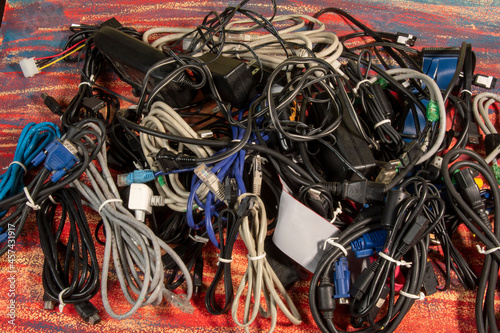 Disused stack of old computer cables and devices 1