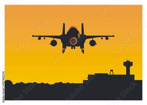 Fighter jet plane flying over an airport. Rear view.