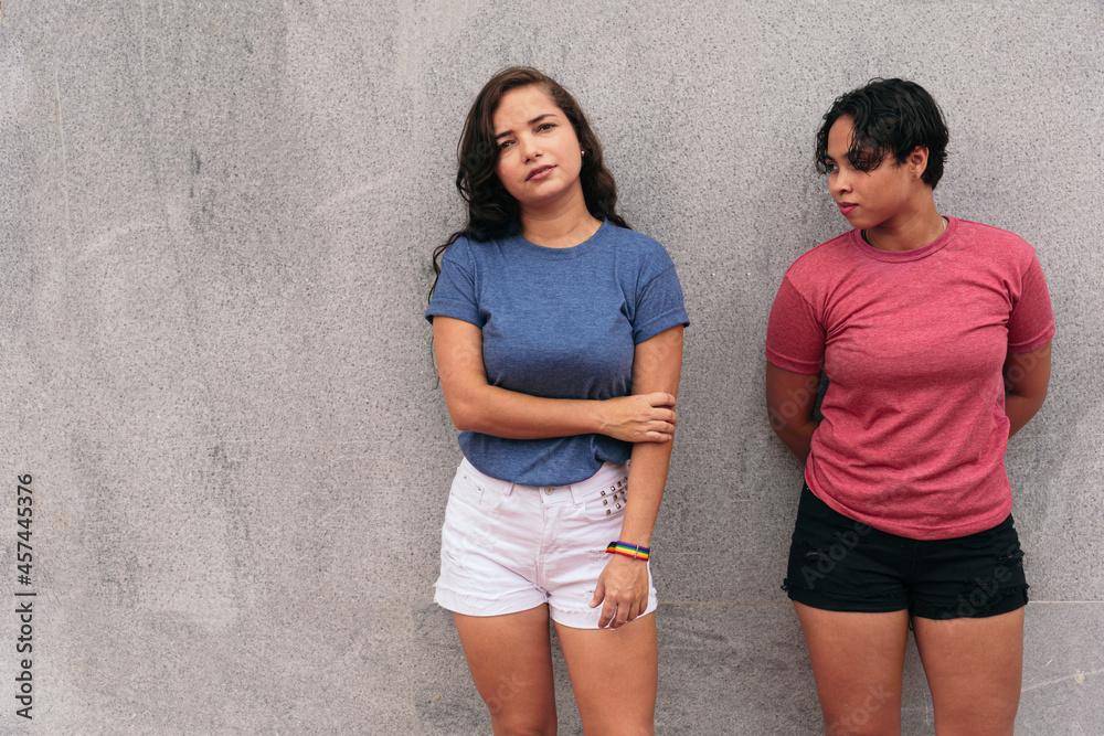 Portrait of Latin lesbian couple in the street. Portrait of Latin lesbian couple in the street.