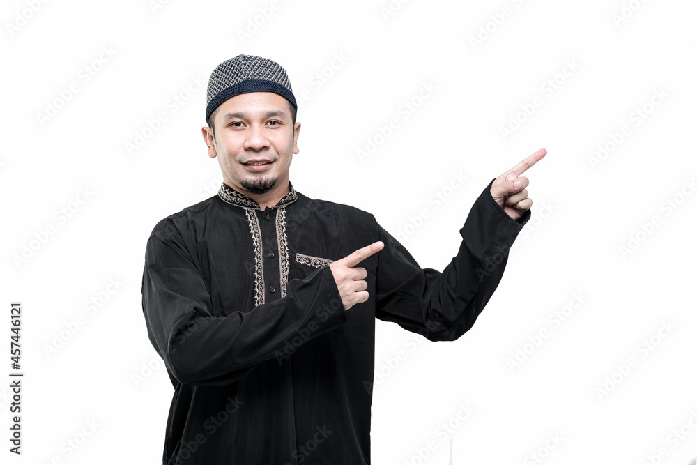 Portrait Asian Muslim men standing showing and presenting something with hand on white background. Portrait Asian Muslim men standing showing and presenting something with hand on white background.