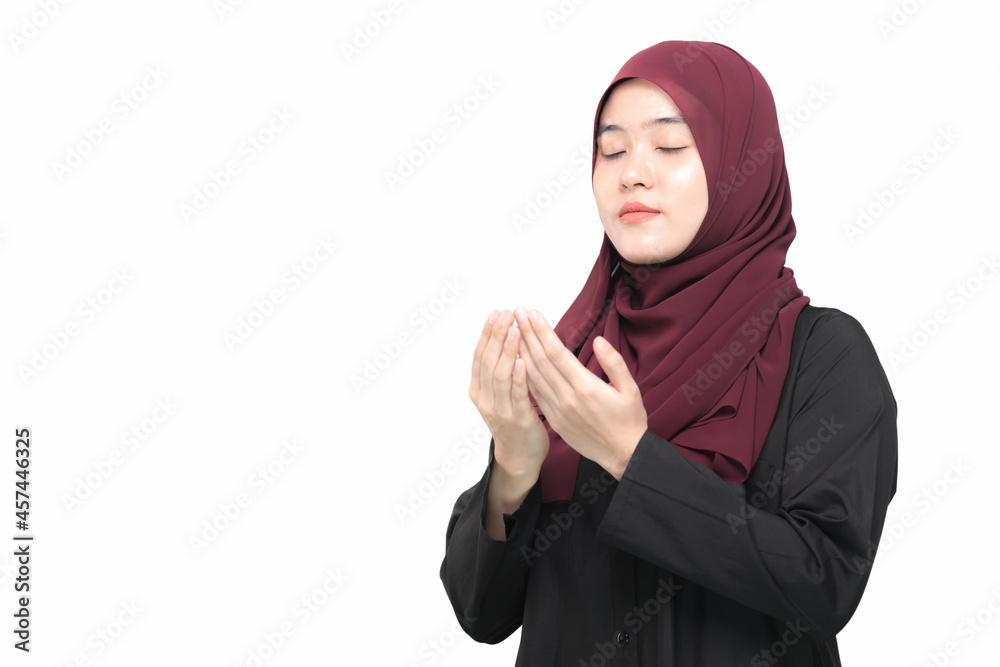 Portrait Asian Muslim woman is praying for prayer with faith and determination. on white background. Portrait Asian Muslim woman is praying for prayer with faith and determination. on white background.