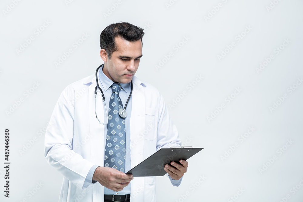 Portrait of cheerful smiling man doctor with stethoscope holding document folder on white background. Portrait of cheerful smiling man doctor with stethoscope holding document folder on white background.